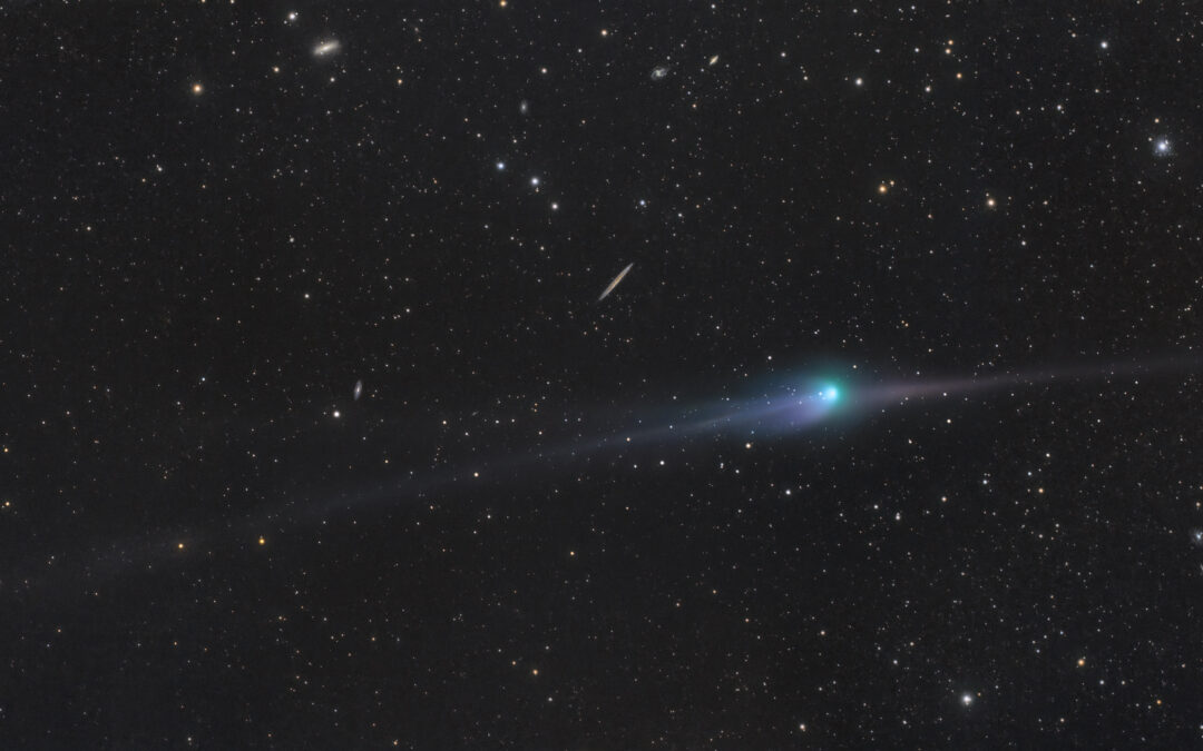 Comet 2022 E3 across a galaxy field